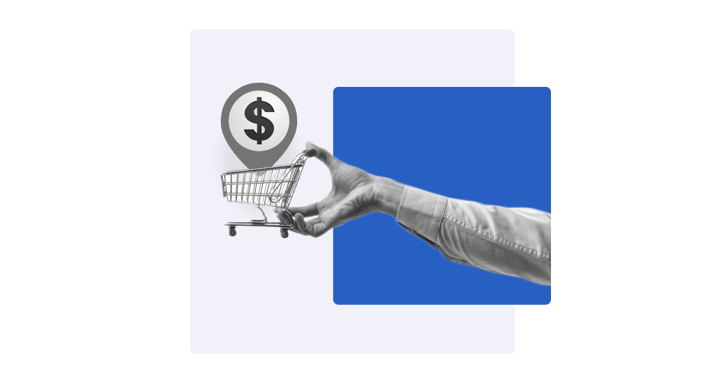 Mão masculina segurando um carrinho de compras com símbolo de cifrão em ícone de localização