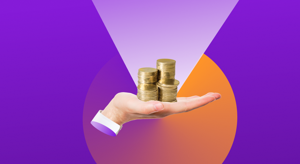 Mão segurando moedas fazendo referência ao cálculo do ROI