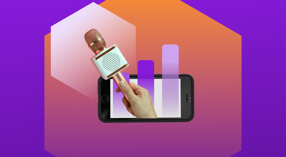 Celular com gráficos representando métricas e mão segurando microfone